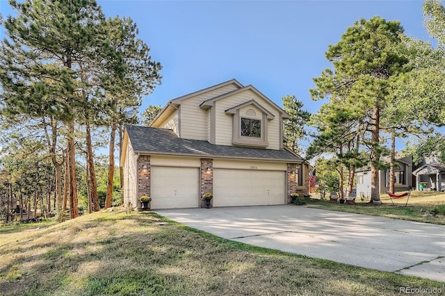 view of front of home featuring driveway, brick siding, a shingled roof, an attached garage, and a front yard