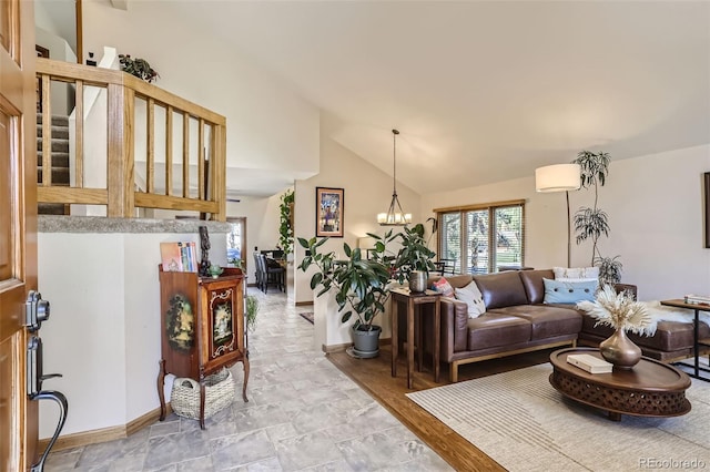 living area with stairs, baseboards, lofted ceiling, and a chandelier