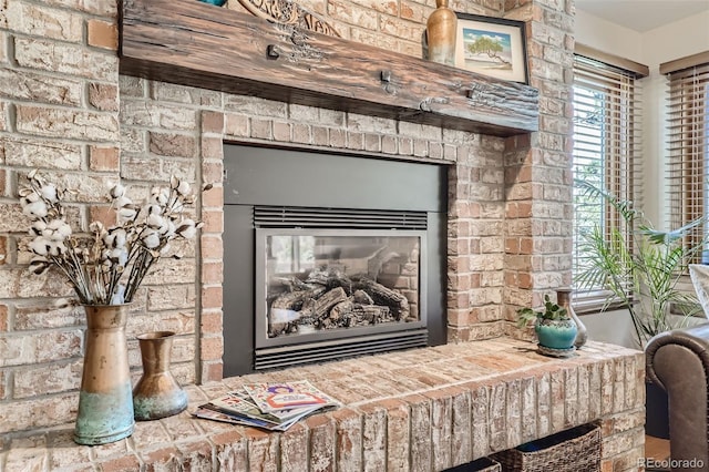 details featuring a brick fireplace