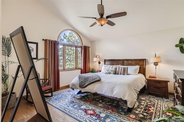 bedroom with lofted ceiling, wood-type flooring, and ceiling fan