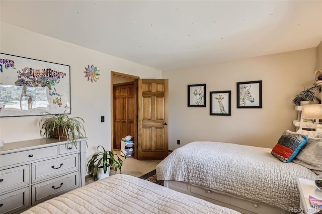 bedroom featuring light carpet