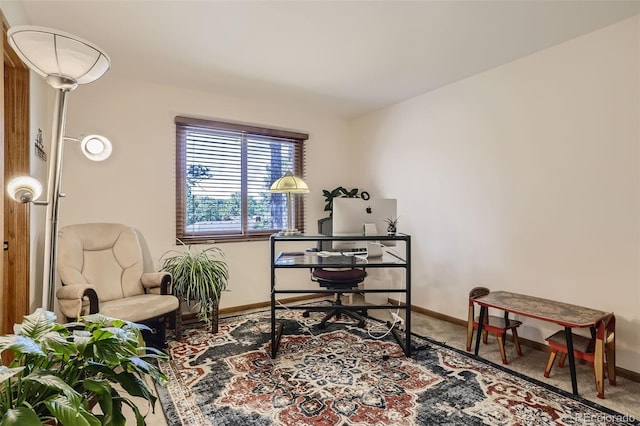 office featuring baseboards and carpet flooring