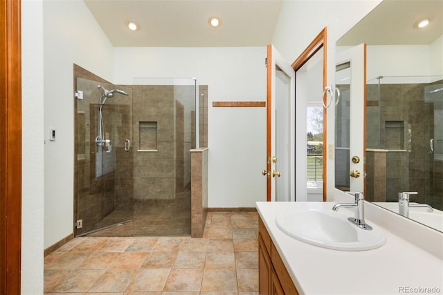 6668 Fairways Dr, Longmont, CO 80503 - bathroom with a shower stall, vanity, and recessed lighting