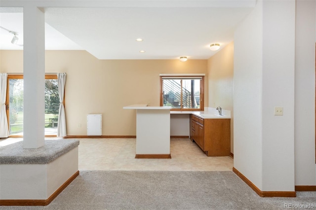 6668 Fairways Dr, Longmont, CO 80503 - unfurnished office featuring baseboards, a sink, light carpet, and recessed lighting