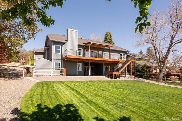 6668 Fairways Dr, Longmont, CO 80503 - rear view of house featuring a wooden deck, stairs, and a chimney