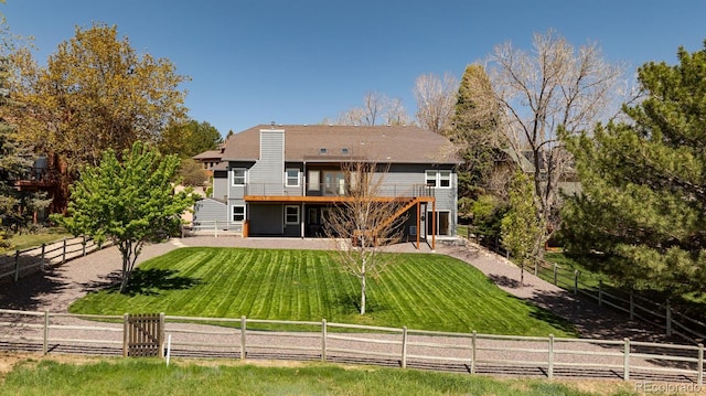 6668 Fairways Dr, Longmont, CO 80503 - back of house featuring a deck, a chimney, and stairs