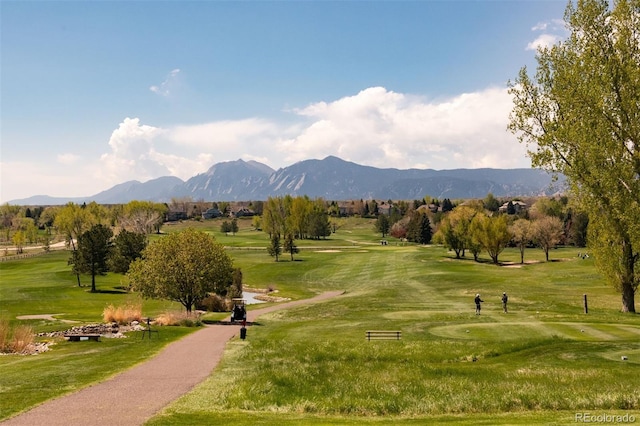 6668 Fairways Dr, Longmont, CO 80503 - view of home's community with view of golf course, a mountain view, and a lawn