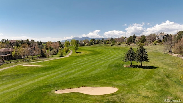 6668 Fairways Dr, Longmont, CO 80503 - view of community featuring golf course view, a lawn, and a mountain view