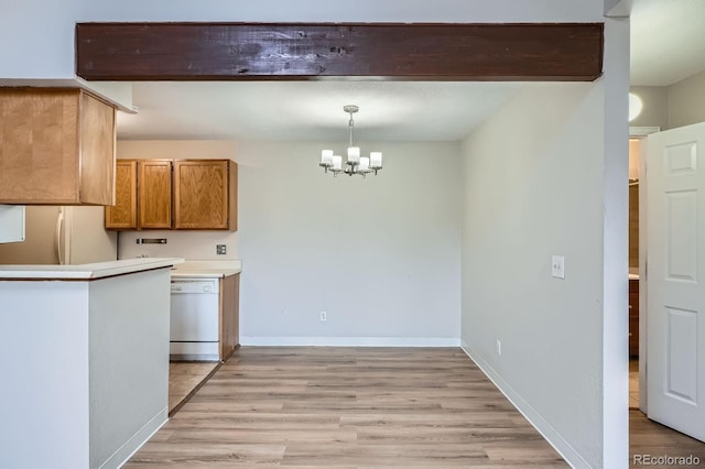 kitchen featuring white appliances, a chandelier, light wood-style flooring, brown cabinetry, and decorative light fixtures