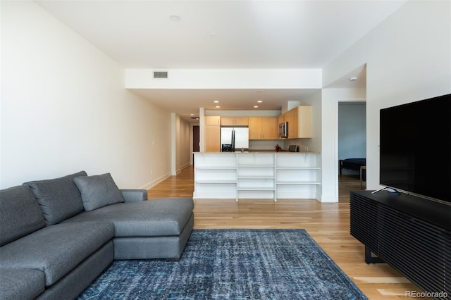 living room with light hardwood / wood-style floors