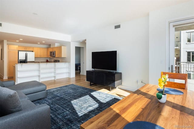 living room featuring light wood-type flooring