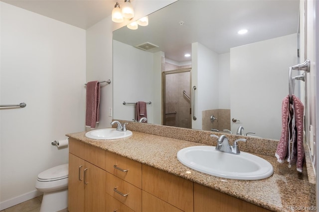 bathroom featuring vanity, an enclosed shower, tile patterned flooring, and toilet