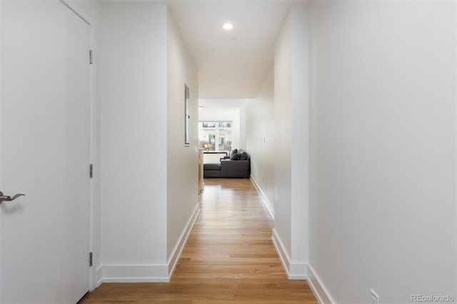 hall with light hardwood / wood-style flooring