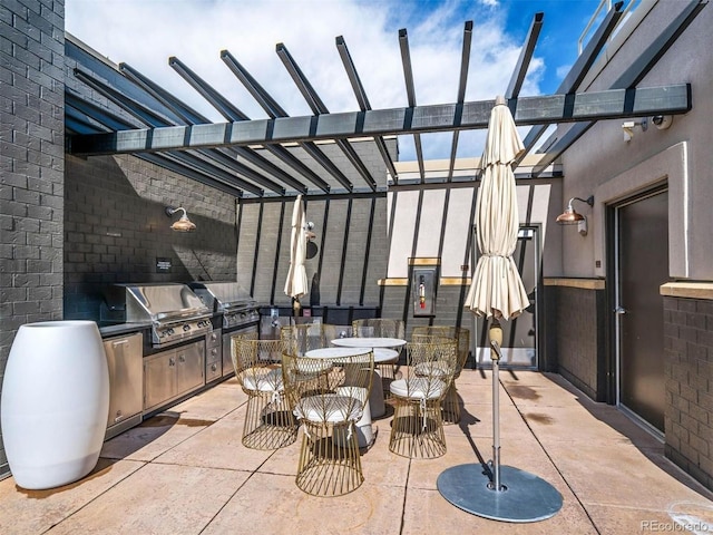 view of patio / terrace featuring grilling area and an outdoor kitchen