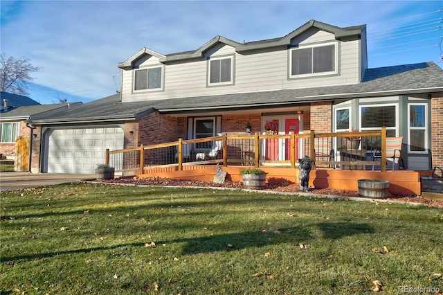 view of front facade with a garage and a front lawn