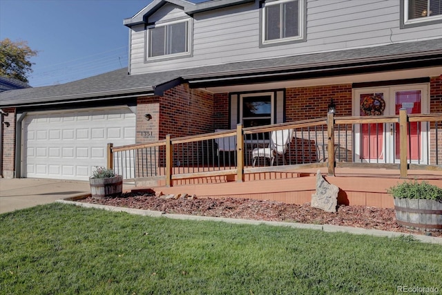 view of front of home featuring covered porch and a garage