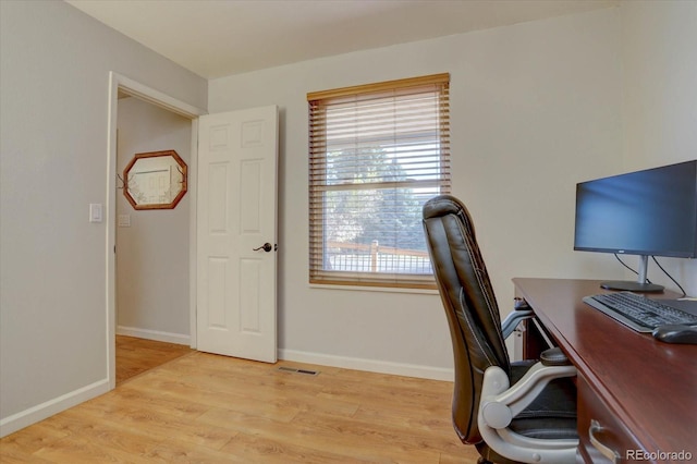 office space featuring light wood-type flooring