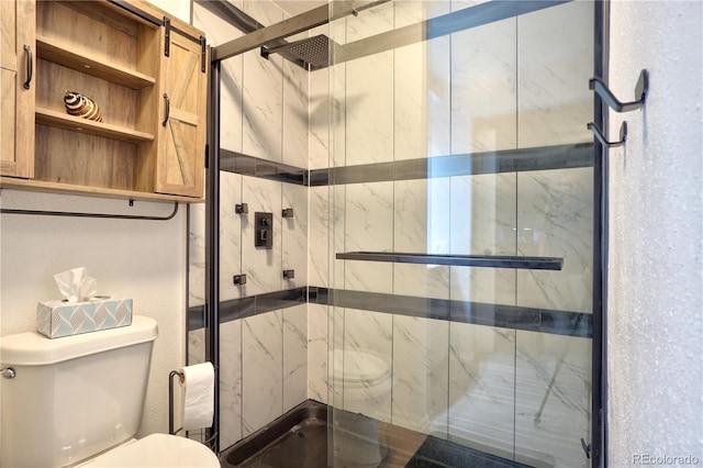 bathroom with toilet and walk in shower