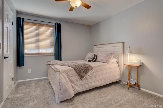 bedroom featuring ceiling fan and light carpet