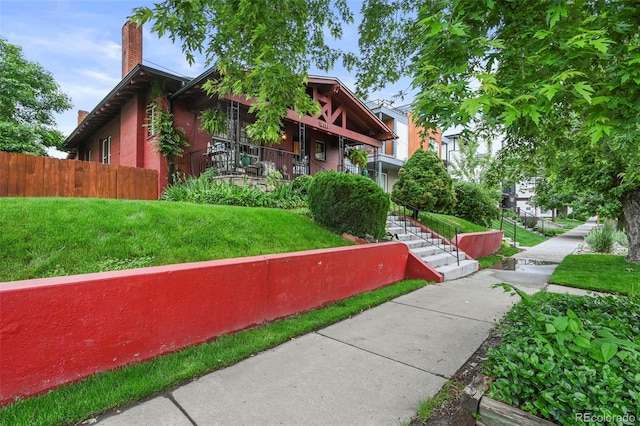 2131 Eliot St, Denver, CO 80211 - view of front of house with a chimney and covered porch