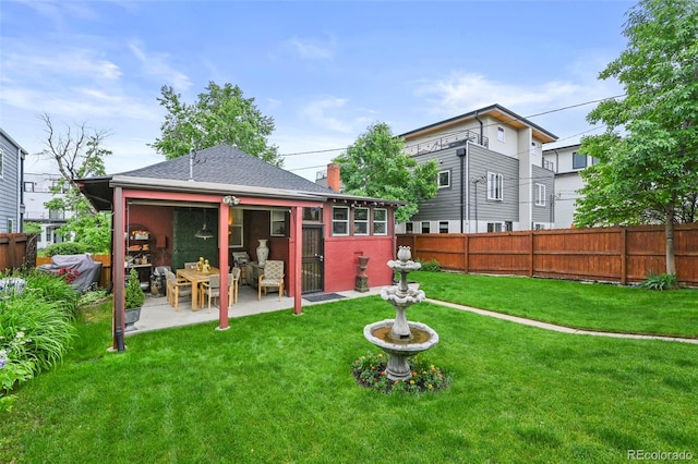 2131 Eliot St, Denver, CO 80211 - back of house featuring a patio, a chimney, and roof with shingles