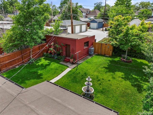 2131 Eliot St, Denver, CO 80211 - view of yard with a detached garage and a residential view