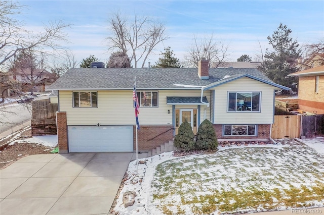 raised ranch featuring a garage