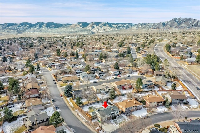 birds eye view of property featuring a mountain view