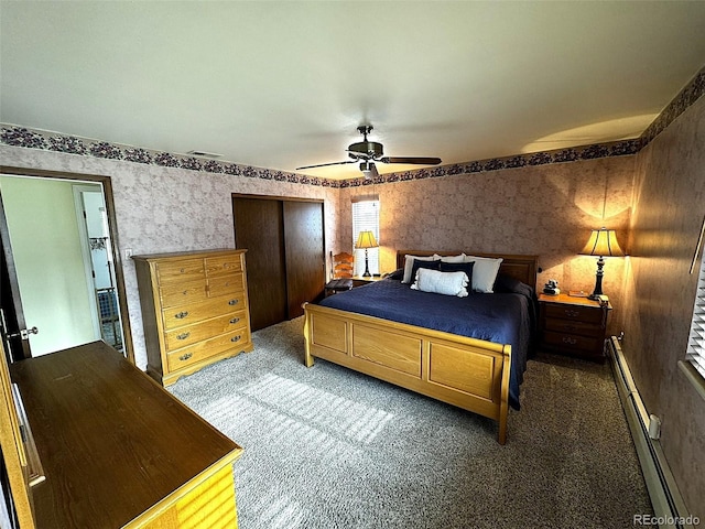 bedroom featuring baseboard heating, ceiling fan, and dark carpet