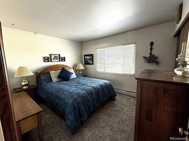 bedroom featuring a textured ceiling, baseboard heating, and dark carpet