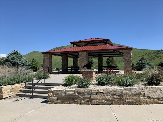 view of community featuring a gazebo and a mountain view