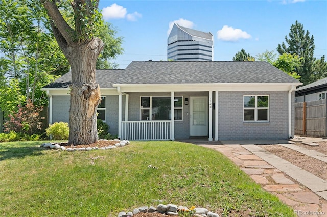1120 S Harrison St, Denver, CO 80210 - ranch-style house featuring brick siding, covered porch, a chimney, and roof with shingles