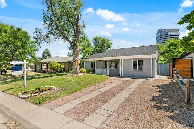 1120 S Harrison St, Denver, CO 80210 - ranch-style home with driveway, brick siding, a porch, a shingled roof, and a gate