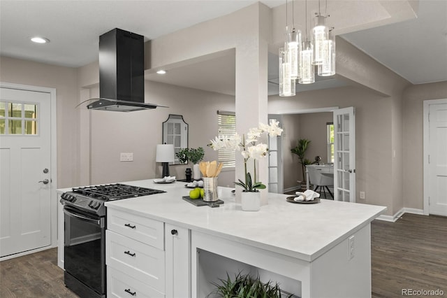 1120 S Harrison St, Denver, CO 80210 - kitchen featuring gas range, island range hood, dark wood-type flooring, white cabinetry, and light countertops
