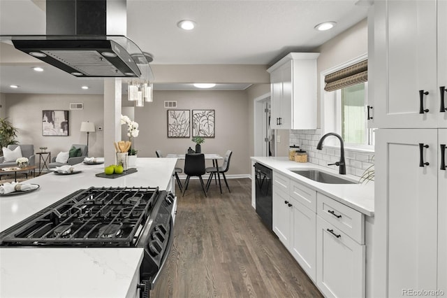 1120 S Harrison St, Denver, CO 80210 - kitchen featuring range hood, range with gas stovetop, dishwasher, dark wood-type flooring, and white cabinetry