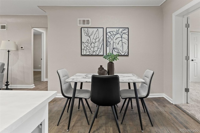 1120 S Harrison St, Denver, CO 80210 - dining area with dark wood-style floors
