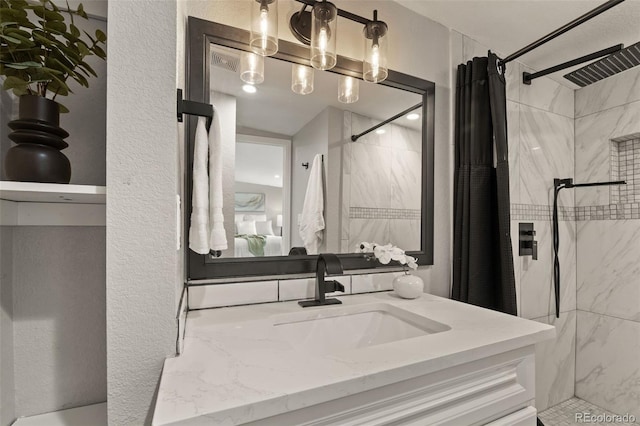 1120 S Harrison St, Denver, CO 80210 - ensuite bathroom featuring vanity, a shower with curtain, and a textured wall