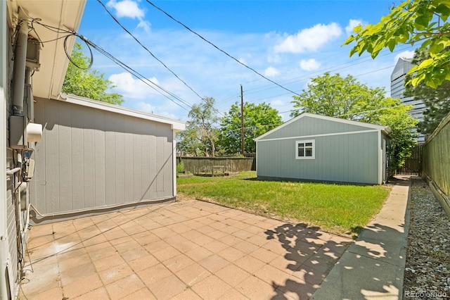 1120 S Harrison St, Denver, CO 80210 - fenced backyard featuring a patio area and an outdoor structure