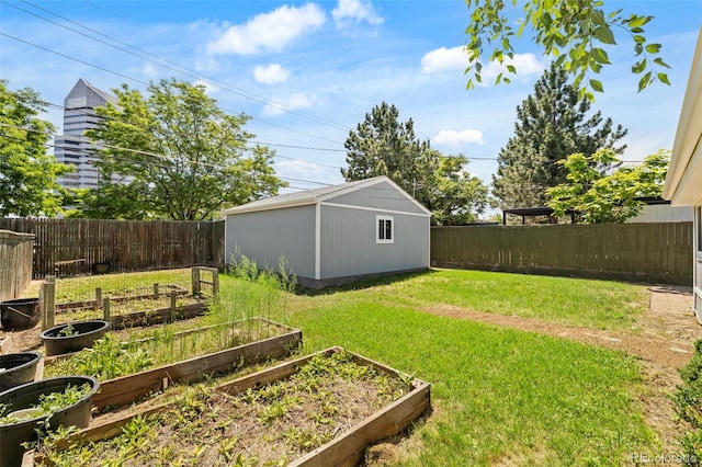 1120 S Harrison St, Denver, CO 80210 - fenced backyard with a vegetable garden and an outdoor structure