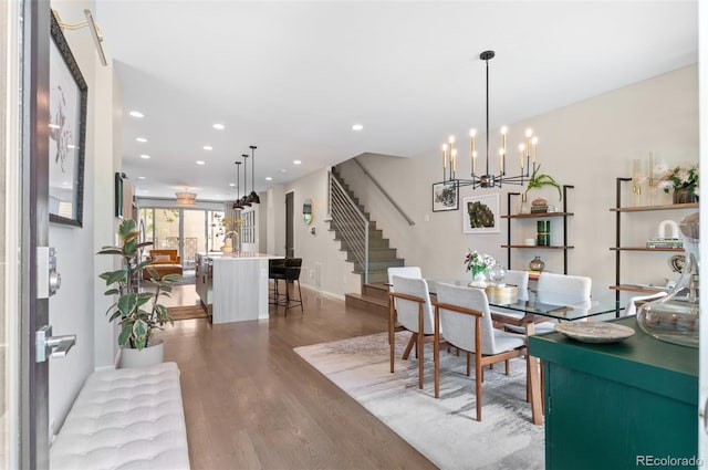 3885 Vrain St, Denver, CO 80212 - dining room featuring stairs, a chandelier, wood finished floors, recessed lighting, and baseboards