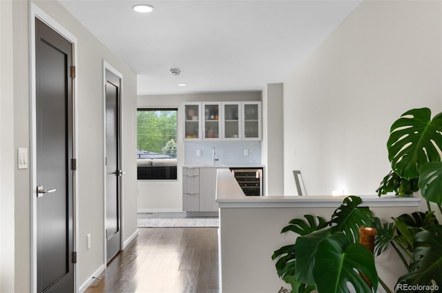 3885 Vrain St, Denver, CO 80212 - corridor with dark wood finished floors, wine cooler, a sink, recessed lighting, and baseboards