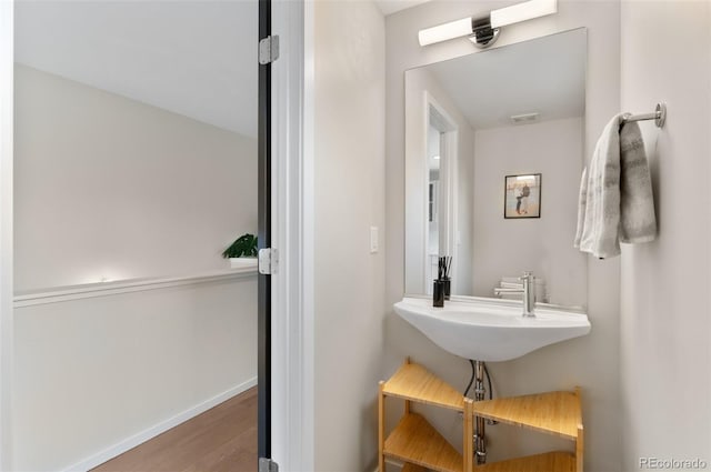 3885 Vrain St, Denver, CO 80212 - bathroom featuring wood finished floors, a sink, and baseboards