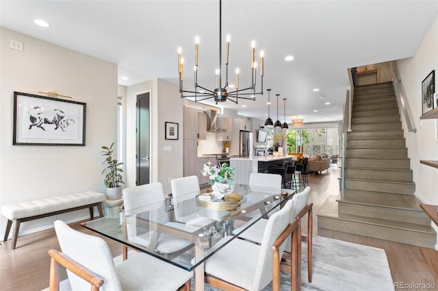 3885 Vrain St, Denver, CO 80212 - dining space featuring stairway, light wood-style floors, recessed lighting, baseboards, and a chandelier