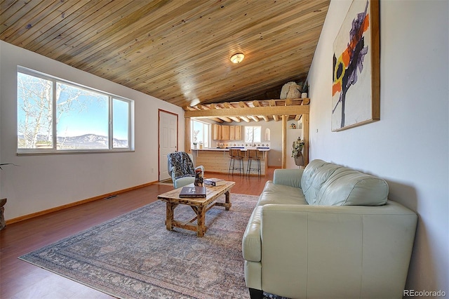 living room featuring lofted ceiling, wood ceiling, baseboards, and wood finished floors