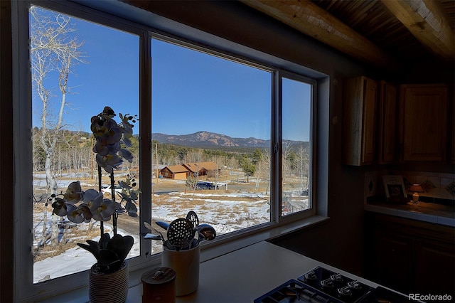 kitchen with tile counters, stovetop, and a mountain view