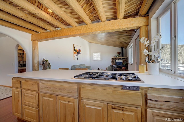 kitchen featuring wood ceiling, light countertops, and light brown cabinetry