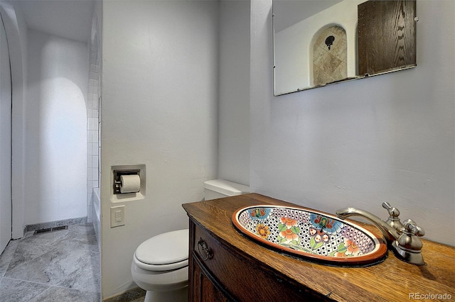 bathroom featuring toilet, a shower, a bath, and vanity