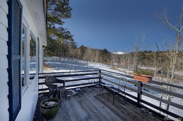 view of snow covered deck