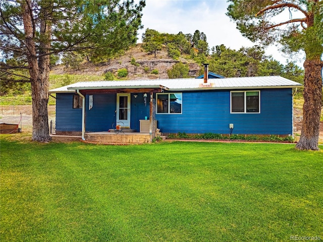 ranch-style home featuring a front yard