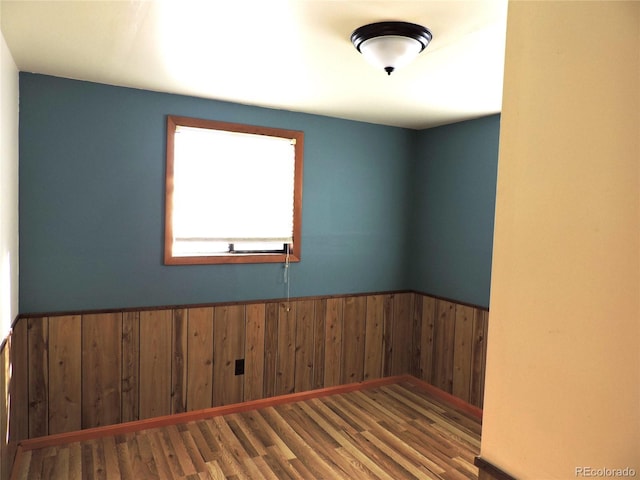 unfurnished room featuring hardwood / wood-style floors